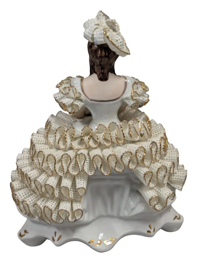 Antique Roceram Romania porcelain figurine, lady sitting holding flowers