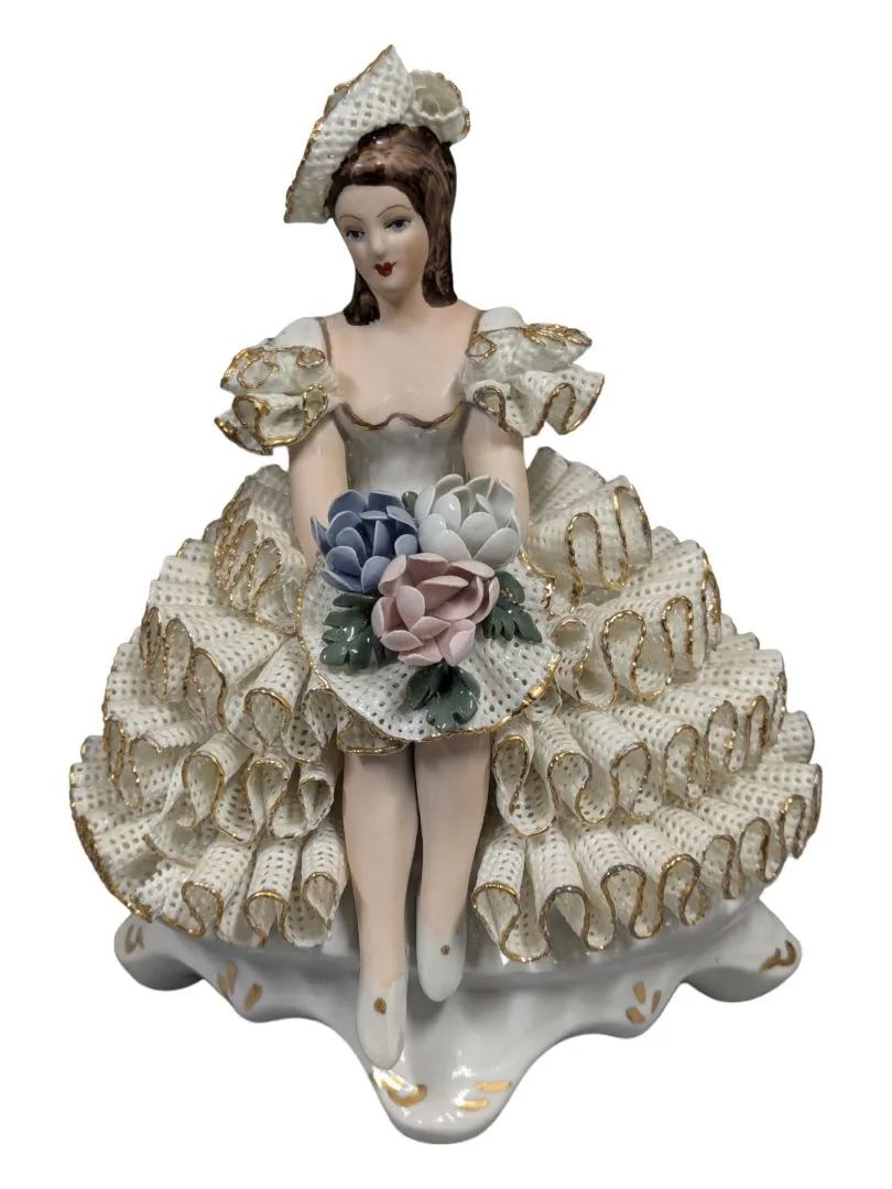 Antique Roceram Romania porcelain figurine, lady sitting holding flowers