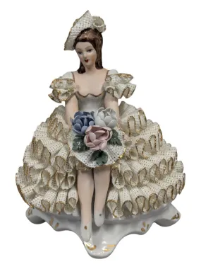 Antique Roceram Romania porcelain figurine, lady sitting holding flowers