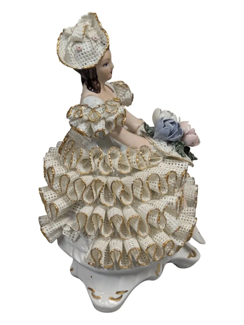 Antique Roceram Romania porcelain figurine, lady sitting holding flowers